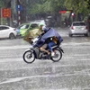Mưa lớn tại Hà Nội do ảnh hưởng của hoàn lưu bão số 3. (Ảnh: Tuấn Đức/TTXVN)