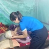 Phụng dưỡng, chăm sóc, thăm hỏi, động viên Mẹ Việt Nam anh hùng trên địa bàn tỉnh Thanh Hóa. (Ảnh minh họa: TTXVN phát)