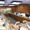 Đoàn đại biểu thành phố Hà Nội thảo luận ở tổ. (Ảnh: Doãn Tấn/TTXVN)