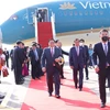 Lễ đón Thủ tướng Phạm Minh Chính tại sân bay quốc tế Phnom Penh. (Ảnh: Dương Giang/TTXVN)