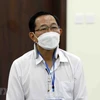 Bị cáo Cao Minh Quang (sinh năm 1956, cựu Thứ trưởng Bộ Y tế) tại phiên xét xử sơ thẩm. (Ảnh: Phạm Kiên/TTXVN)