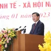 Phó Thủ tướng Lê Minh Khái trình bày Báo cáo triển khai Kế hoạch phát triển kinh tế-xã hội năm 2023. (Ảnh: Dương Giang/TTXVN)