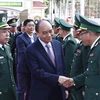 Chủ tịch nước Nguyễn Xuân Phúc thăm, chúc Tết cán bộ, chiến sỹ Bộ đội Biên phòng tỉnh Đắk Lắk. (Ảnh: Thống Nhất/TTXVN)