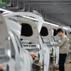 Công nhân làm việc tại nhà máy sản xuất xe của Tập đoàn sản xuất ô tô Hàn Quốc Hyundai Motor Group tại Thương Châu, tỉnh Hà Bắc (Trung Quốc) ngày 21/2/2017. (Ảnh: AFP/TTXVN)