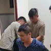 Yang Zhong Wu bị công an bắt giữ. (Ảnh: TTXVN phát)