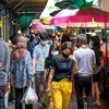 Người dân tại Bangkok, Thái Lan. (Ảnh: AFP/TTXVN)