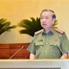 Bộ trưởng Bộ Công an Tô Lâm trình bày Tờ trình về dự án Luật Căn cước công dân (sửa đổi). (Ảnh: Doãn Tấn/TTXVN)