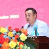 Phó Bí thư Thành ủy, Chủ tịch Ủy ban Nhân dân thành phố Hà Nội Trần Sỹ Thanh trình bày báo cáo. (Ảnh: An Đăng/TTXVN)