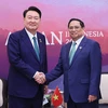 Thủ tướng Phạm Minh Chính gặp Tổng thống Hàn Quốc Yoon Suk Yeol. (Ảnh: Dương Giang/TTXVN)