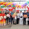 Ban Liên lạc Cộng đồng người Việt tại Singapore lần thứ 2 tham dự Lễ hội với gian hàng được trang trí đặc sắc. (Ảnh: Lê Dương/TTXVN)