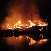Nguyên nhân ban đầu vụ cháy tàu cá ở Quảng Ninh được xác định là do chập điện và cháy dầu lan. (Ảnh: TTXVN phát)