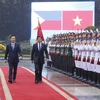 Chủ tịch nước Võ Văn Thưởng và Tổng thống Philippines Ferdinand Romualdez Marcos Jr. duyệt Đội danh dự QĐND Việt Nam. (Ảnh: Thống Nhất/TTXVN)
