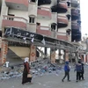 Các tòa nhà bị phá hủy sau cuộc không kích của Israel xuống Dải Gaza ngày 19/1/2024. Ảnh: THX/TTXVN
