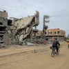 Những tòa nhà bị phá hủy sau cuộc không kích của Israel xuống Dải Gaza ngày 23/2/2024. (Ảnh: THX/TTXVN)