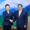 Thủ tướng Phạm Minh Chính tiếp Bộ trưởng Tư pháp Trung Quốc Hạ Vinh. (Ảnh: Dương Giang/TTXVN)