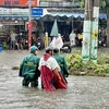 Khu vực Tỉnh lộ 43, thành phố Thủ Đức trở thành “biển nước” sau cơn mưa. (Ảnh: Hồng Giang/TTXVN)
