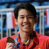 Vận động viên Nguyễn Quang Thuấn đoạt Huy chương Vàng nội dung bơi 200m hỗn hợp nam. (Ảnh: Trần Lê Lâm/TTXVN)