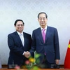 Thủ tướng Phạm Minh Chính hội đàm với Thủ tướng Hàn Quốc Han Duck Soo. (Ảnh: Dương Giang/TTXVN)