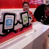 Một điểm bán hàng tại Trung Quốc khuyến khích khách hàng sử dụng Alipay hoặc Tenpay. (Nguồn: ChinaDaily)