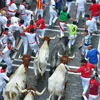 Những màn rượt đuổi thót tim tại lễ hội chạy với bò tót ở Pamplona, Tây Ban Nha ngày 12/7/2019. (Ảnh: AFP/TTXVN)