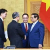 Thủ tướng Phạm Minh Chính tiếp Đại sứ Trung Quốc tại Việt Nam Hùng Ba đến chào từ biệt, kết thúc nhiệm kỳ công tác.(Ảnh: Dương Giang/TTXVN)