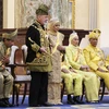 Quốc vương Malaysia Sultan Ibrahim và Hoàng hậu Raja Zarith Sofiah Idris Shah trong trang phục nghi lễ Hoàng cung cùng bước lên ngai vàng trong lễ đăng quang ở Kuala Lumpur, ngày 20/7/2024. (Ảnh: AFP/TTXVN)