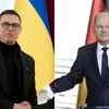 Tổng thống Phần Lan Alexander Stubb (trái) và Thủ tướng Đức Olaf Scholz. (Nguồn; AFP/TTXVN)