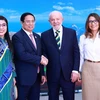 Tổng thống Brazil, Chủ tịch G20 Luiz Inácio Lula da Silva và Phu nhân đón Thủ tướng Phạm Minh Chính và Phu nhân. (Ảnh: Dương Giang/TTXVN)