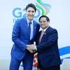 Thủ tướng Phạm Minh Chính gặp Thủ tướng Canada Justin Trudeau. (Ảnh: Dương Giang/TTXVN)