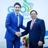 Thủ tướng Phạm Minh Chính gặp Thủ tướng Canada Justin Trudeau. (Ảnh: Dương Giang/TTXVN)