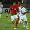 U23 Indonesia (áo đỏ) lách khe cửa hẹp vào bán kết.