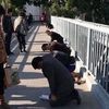 Trung Quốc: Tranh cãi việc nhân viên bị phạt quỳ gối trên đường