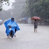 Mưa lớn gây ngập úng tại nhiều tuyến đường trong trung tâm T.P Thái Nguyên. (Ảnh: Lan Anh/TTXVN)