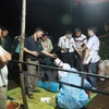 Lực lượng chức năng đang khám nghiệm hiện trường vụ thảm sát ở Gia Lai. (Ảnh: Nguyễn Hoài Nam/TTXVN)