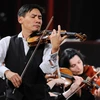 Nghệ sỹ violin gốc Việt Nguyễn Hữu Nguyên. (Ảnh: Minh Đức/TTXVN)