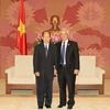 Phó Chủ tịch Quốc hội Uông Chu Lưu tiếp ông Khamphansin Malavong. (Ảnh: Phạm Kiên/TTXVN)