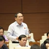 Đại biểu Quốc hội tỉnh Sơn La Phùng Khắc Đăng phát biểu ý kiến. (Ảnh: Phương Hoa/TTXVN)