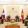 Đại tướng Phùng Quang Thanh, Bộ trưởng Bộ Quốc phòng tiếp Đại sứ Lào tại Việt Nam Thongsavanh Phomvihane. (Ảnh: Hồng Pha/TTXVN)