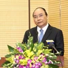 Phó Thủ tướng Nguyễn Xuân Phúc phát biểu tại hội nghị. (Ảnh: An Đăng/TTXVN)