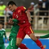 Tuyển Việt Nam (áo đỏ) thua trận trước Iraq. (Nguồn: AFP)
