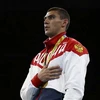 Evgheny Tishchenko trên bục nhận huy chương. (Nguồn: AP)