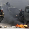 Binh sỹ Israel được triển khai để đối phó với người biểu tình Palestine tại khu vực ngoại ô Ramallah, Bờ Tây, ngày 27/3. (Ảnh: AFP/TTXVN)