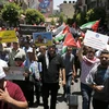Người dân Palestine biểu tình phản đối hoạch hòa bình Trung Đông của Mỹ tại thành phố Ramallah, Bờ Tây ngày 25/6. (Ảnh: AFP/TTXVN)