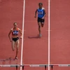 Quách Thị Lan thi đấu ở nội dung 400m chạy vượt rào nữ tại ASIAD 2018. (Ảnh: AFP/TTXVN)