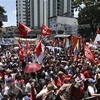 Người dân tuần hành ủng hộ Tổng thống Venezuela Nicolas Maduro tại thủ đô Caracas ngày 6/4. (Nguồn: AFP/TTXVN)
