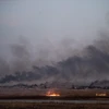 Khói bốc lên ở thị trấn Tal Abyad, miền Bắc Syria khi quân đội Thổ Nhĩ Kỳ tiến hành chiến dịch tấn công các tay súng người Kurd, ngày 10/10. (Ảnh: AFP/TTXVN)