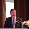 Phó Chủ tịch Ủy ban Nhân dân tỉnh Bình Phước Huỳnh Anh Minh phát biểu tại hội thảo. (Ảnh: Hữu Kiên/TTXVN)