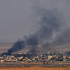 Khói bốc lên sau một cuộc tấn công của Thổ Nhĩ Kỳ tại thành phố Ras al-Ain, Syria, ngày 10/10. (Ảnh: THX/TTXVN)