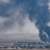 Khói bốc lên sau các cuộc giao tranh ác liệt tại thị trấn biên giới Ras al-Ain, Syria, ngày 17/10. (Ảnh: AFP/TTXVN)