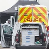Nhân viên pháp y thuộc Cảnh sát Anh điều tra tại hiện trường xe container chở 39 thi thể ở Khu Công nghiệp Waterglade thuộc hạt Essex, miền Đông Nam nước Anh ngày 23/10/2019. (Nguồn: THX/TTXVN)